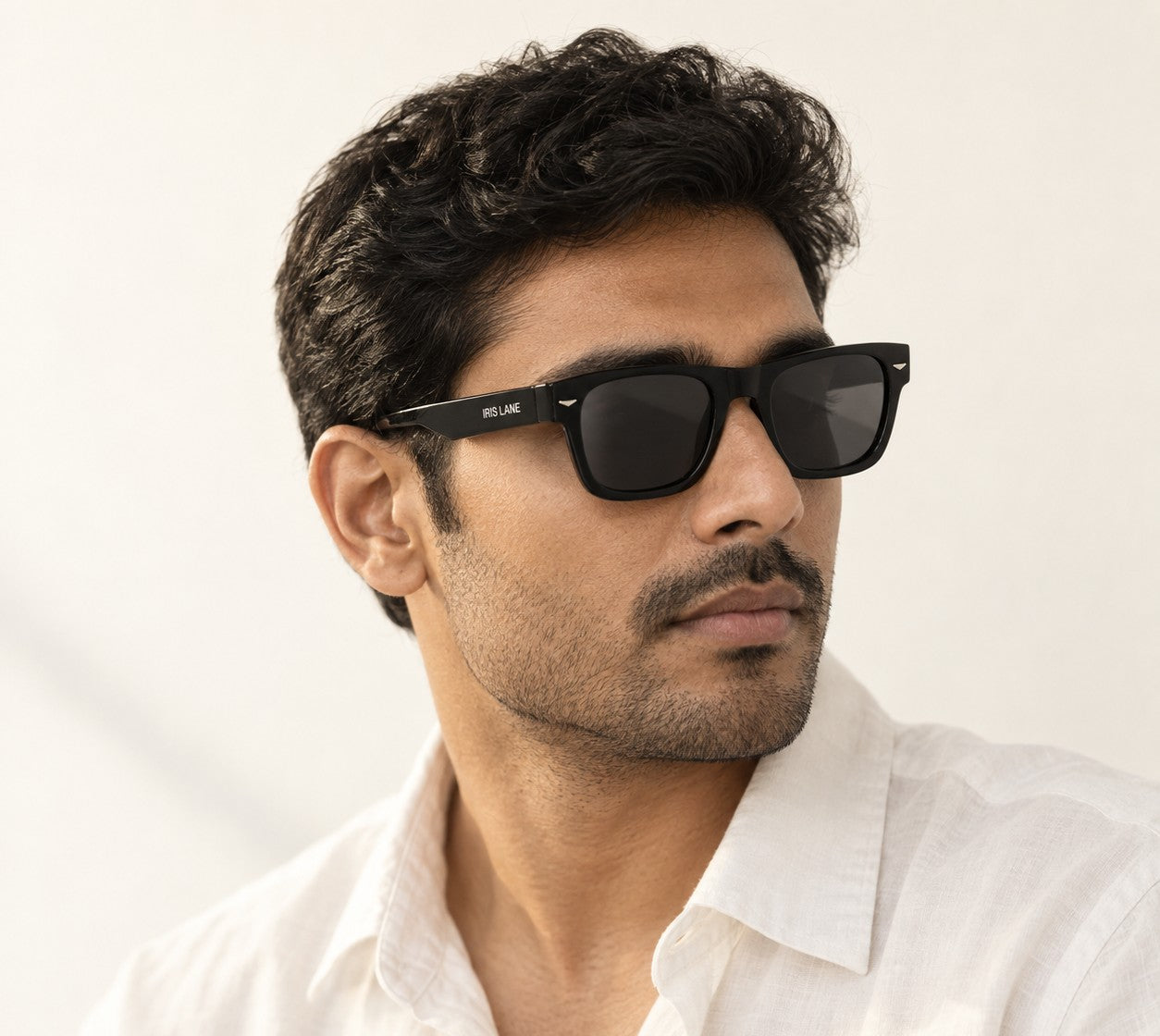 A man wearing Kabir, a black acetate frame
