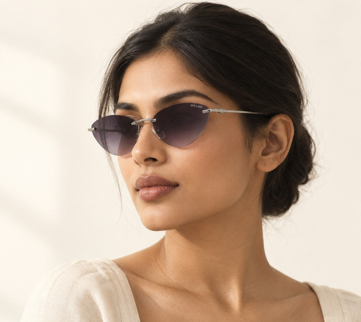 A woman wearing Void, a rimless metal frame